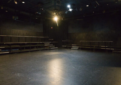 The Bette Condiotti Experimental Theatre with the floor in the foreground and rows of seats in the background against the wall
