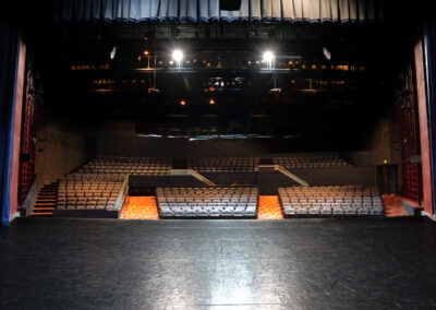 The Nellie W. Codding Theatre view from the stage looking out to the empty audience seats